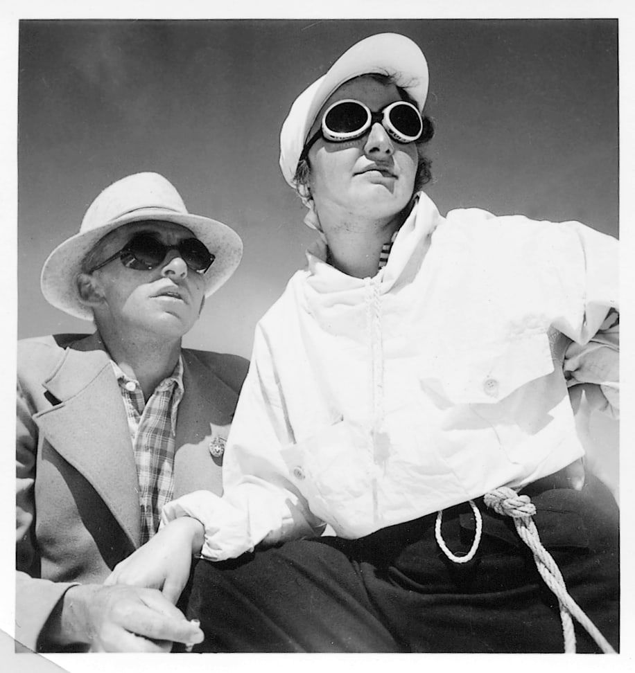 Historic black-and-white photo of two skiers